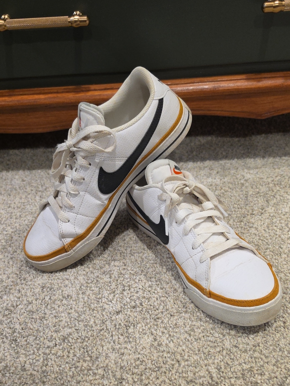 Nike Men’s White Sneakers with Black Swoosh and Gold Trim